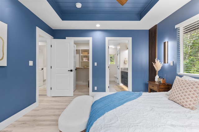 15-1408 13th Ave, Keaau, HI 96749 - bedroom with a tray ceiling, light wood finished floors, multiple windows, and a spacious closet