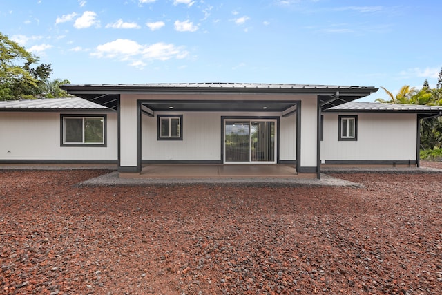 15-1408 13th Ave, Keaau, HI 96749 - back of property featuring a patio area and a metal roof