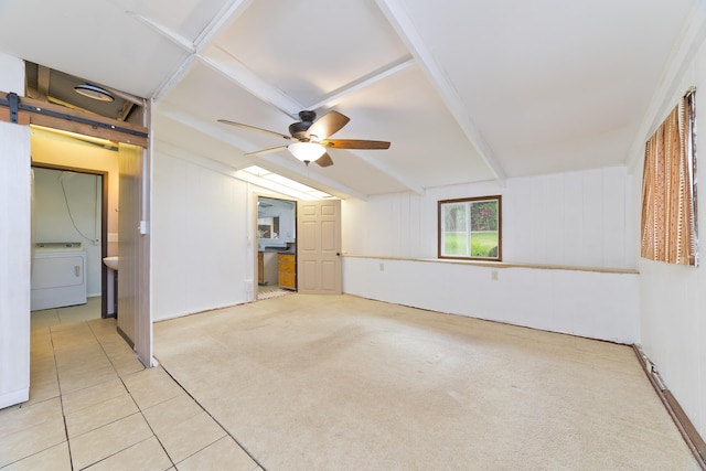 81-6356 Keopuka Pl, Captain Cook, HI 96750 - spare room featuring washer / clothes dryer, ceiling fan, light colored carpet, light tile patterned flooring, and a barn door