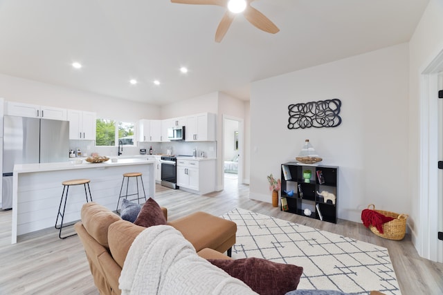 15-1713 32nd Ave, Keaau, HI 96749 - living room with light wood finished floors, a ceiling fan, and recessed lighting