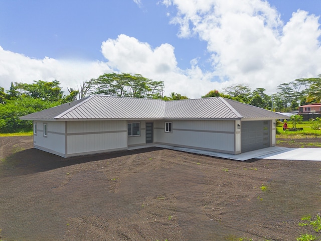 15-1713 32nd Ave, Keaau, HI 96749 - view of front of home featuring driveway, an attached garage, and a metal roof