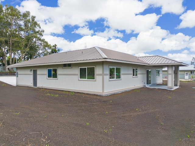 15-1713 32nd Ave, Keaau, HI 96749 - rear view of house with a metal roof
