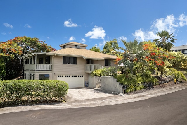 4460 Kai Ikena Dr, Kalaheo, HI 96741 - view of front of property with a garage, concrete driveway, and a balcony