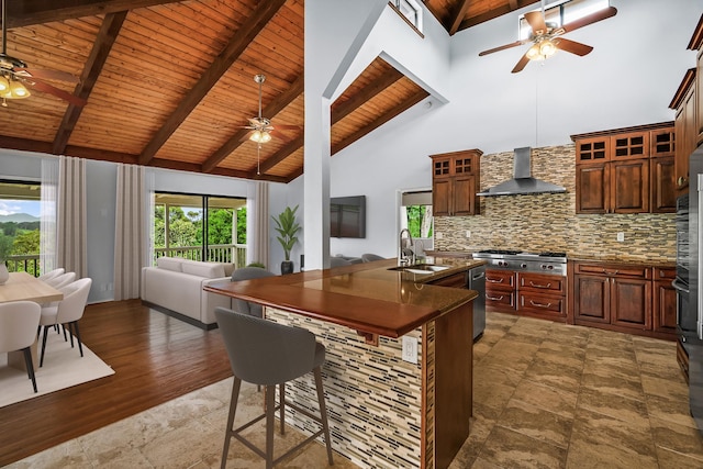 4460 Kai Ikena Dr, Kalaheo, HI 96741 - kitchen featuring ceiling fan, wall chimney range hood, a wooden ceiling with exposed beams, open floor plan, and dark countertops