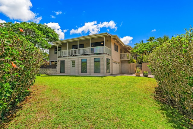 4460 Kai Ikena Dr, Kalaheo, HI 96741 - back of house featuring a balcony, a garage, and a yard