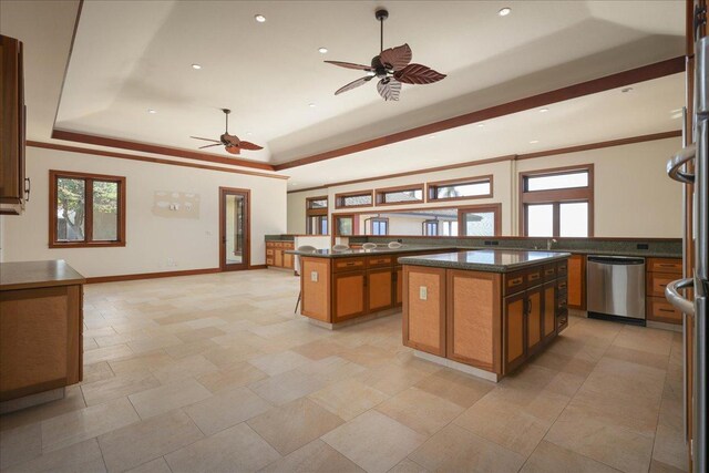 81-580 Kaiue St, Kealakekua, HI 96750 - kitchen with dishwasher, a raised ceiling, ceiling fan, dark countertops, and a center island