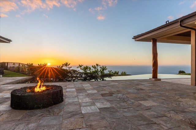 81-580 Kaiue St, Kealakekua, HI 96750 - view of patio / terrace with a fire pit and a water view