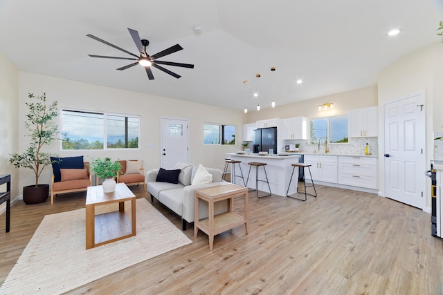 16-2102 Leilani Dr, Pahoa, HI 96778 - living room with lofted ceiling, light wood-style floors, ceiling fan, and recessed lighting