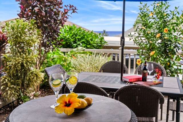 75-5919 Alii Dr Unit M3, Kailua-Kona, HI 96740 - wooden terrace featuring outdoor dining space