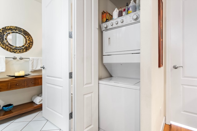 75-5919 Alii Dr Unit M3, Kailua-Kona, HI 96740 - washroom featuring estacked washer and dryer and light tile patterned floors