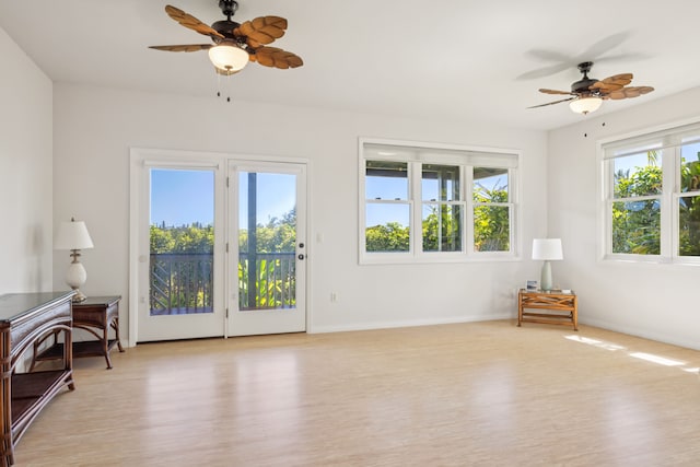 2645 Keoki Pl, Kalaheo, HI 96741 - unfurnished living room featuring light wood-style flooring and a ceiling fan