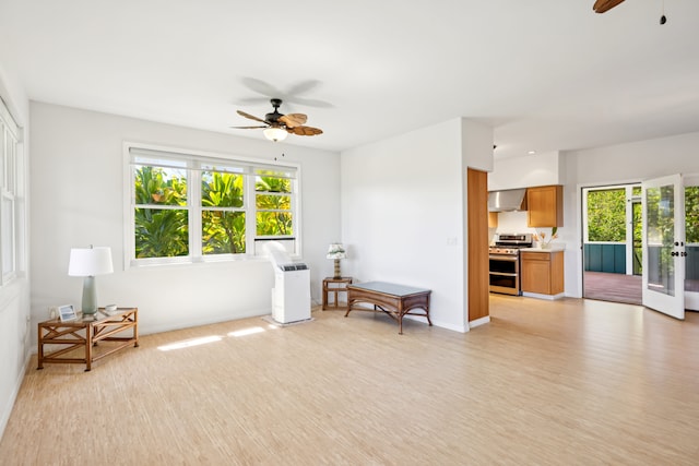 2645 Keoki Pl, Kalaheo, HI 96741 - sitting room featuring a ceiling fan, plenty of natural light, and light wood finished floors