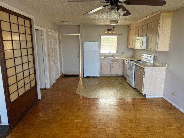 75-5766 Kuakini Hwy Unit 210, Kailua-Kona, HI 96740 - kitchen with white appliances, a ceiling fan, light countertops, and a textured ceiling