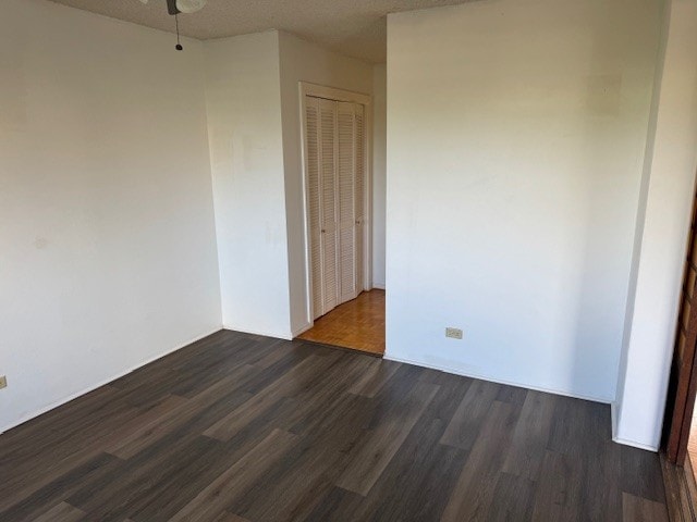 75-5766 Kuakini Hwy Unit 210, Kailua-Kona, HI 96740 - unfurnished room with dark wood finished floors and a ceiling fan