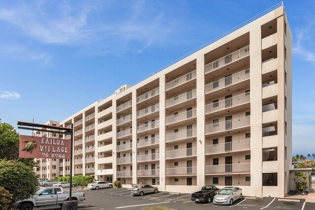 75-5766 Kuakini Hwy Unit 210, Kailua-Kona, HI 96740 - view of apartment building / complex featuring uncovered parking