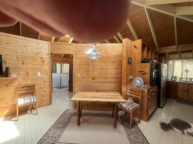 11-3119 Alii Anela St, Volcano, HI 96785 - sitting room with washer and dryer, wooden walls, plenty of natural light, and light tile patterned floors