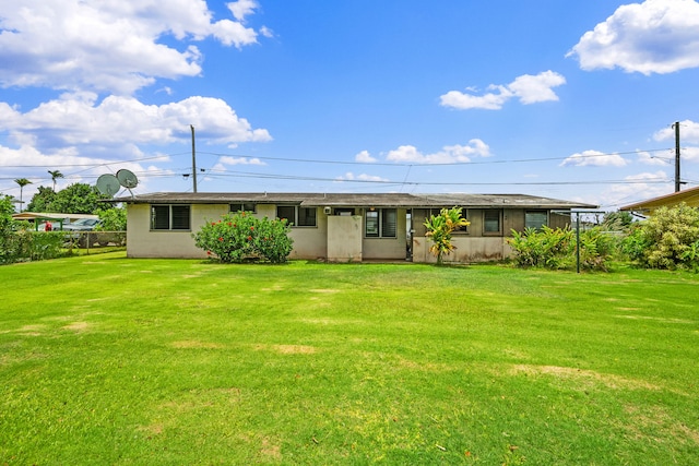 3878 Mamaki St, Koloa, HI 96756 - rear view of property featuring a yard