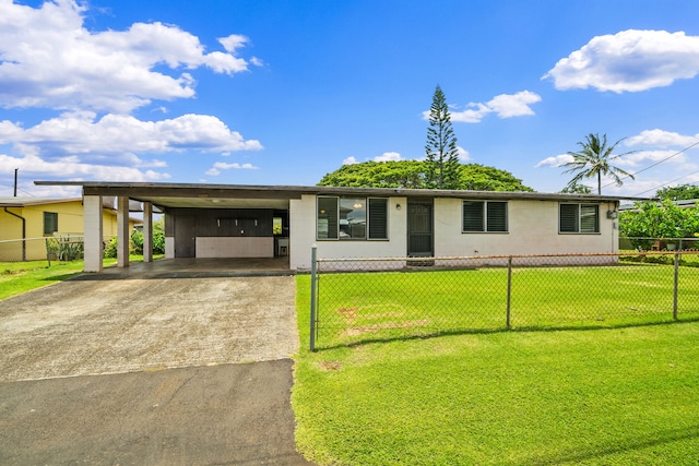 3878 Mamaki St, Koloa, HI 96756 - view of front facade featuring driveway, a fenced front yard, and an attached carport