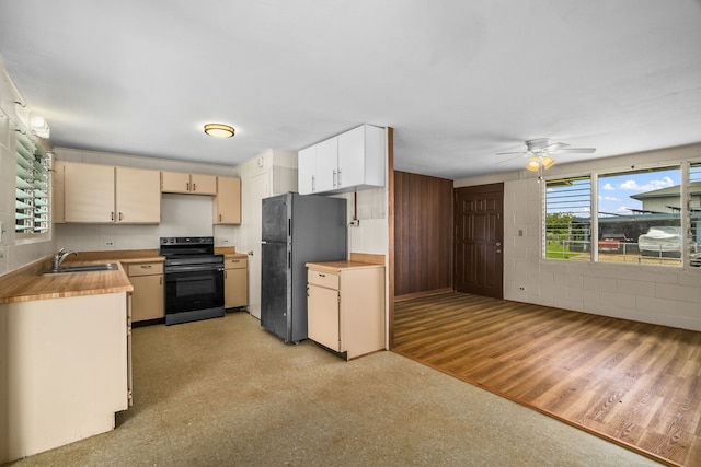 3878 Mamaki St, Koloa, HI 96756 - kitchen with electric range oven, freestanding refrigerator, light flooring, and ceiling fan