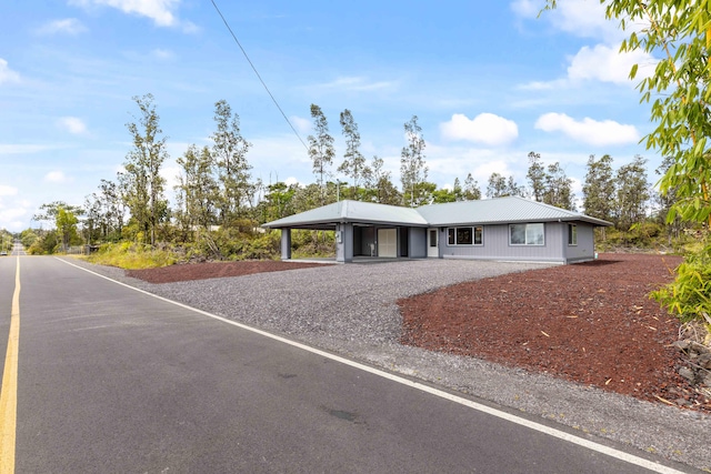 16-2072 Kuhio Dr, Pahoa, HI 96778 - ranch-style home featuring a metal roof, an attached carport, and driveway