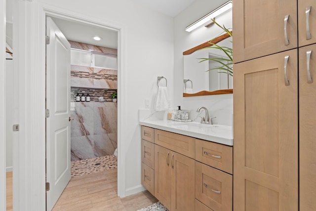 16-2072 Kuhio Dr, Pahoa, HI 96778 - bathroom with vanity, a tile shower, and wood finished floors