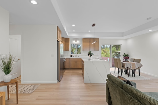 16-2072 Kuhio Dr, Pahoa, HI 96778 - kitchen featuring freestanding refrigerator, light wood-style flooring, recessed lighting, and light stone counters