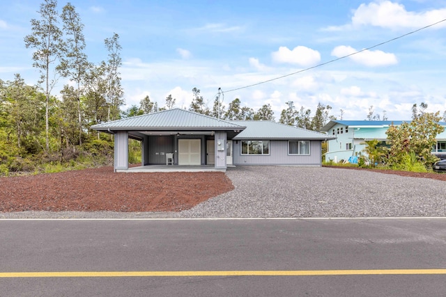 16-2072 Kuhio Dr, Pahoa, HI 96778 - single story home with gravel driveway and a metal roof