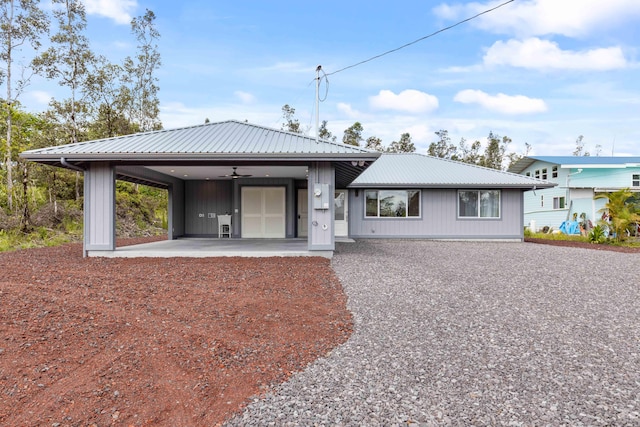 16-2072 Kuhio Dr, Pahoa, HI 96778 - back of house with ceiling fan and a metal roof