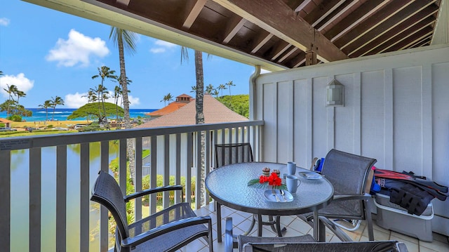 2253 Poipu Rd Unit 216, Koloa, HI 96756 - balcony with a water view and outdoor dining area