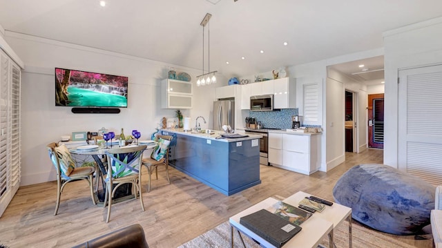 2253 Poipu Rd Unit 216, Koloa, HI 96756 - kitchen with appliances with stainless steel finishes, white cabinetry, light countertops, glass insert cabinets, and tasteful backsplash