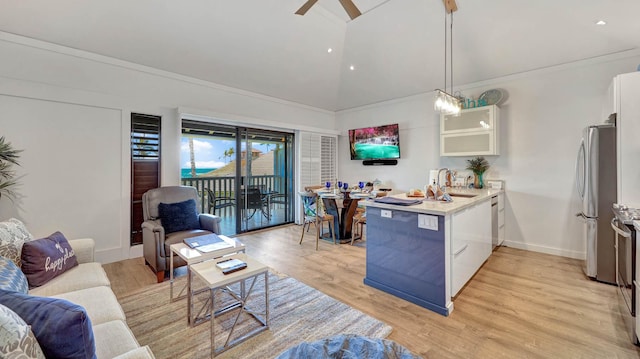 2253 Poipu Rd Unit 216, Koloa, HI 96756 - kitchen featuring a peninsula, ceiling fan, appliances with stainless steel finishes, high vaulted ceiling, and white cabinets