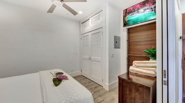2253 Poipu Rd Unit 216, Koloa, HI 96756 - bedroom with light wood-style floors, a closet, a ceiling fan, electric panel, and recessed lighting