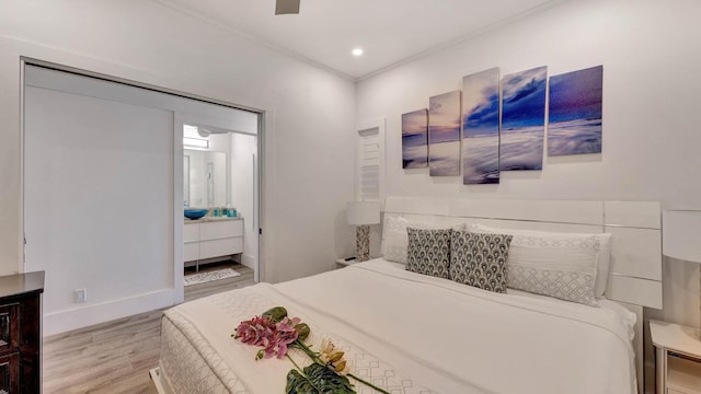 2253 Poipu Rd Unit 216, Koloa, HI 96756 - bedroom with light wood-type flooring, connected bathroom, ceiling fan, crown molding, and recessed lighting