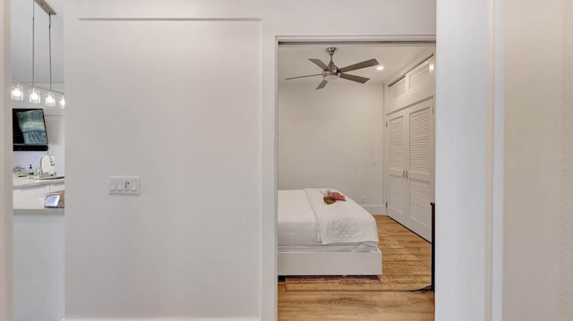 2253 Poipu Rd Unit 216, Koloa, HI 96756 - bedroom with wood finished floors, a closet, and ceiling fan