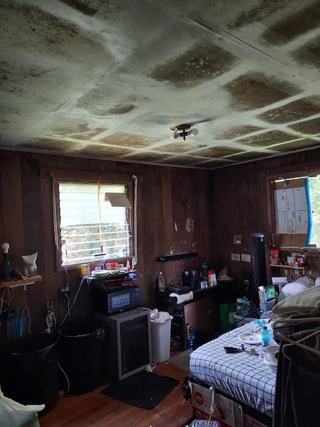 17-4136 Kukui Camp Rd, Mountain View, HI 96771 - bedroom with multiple windows, wood finished floors, and wood walls