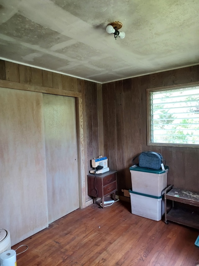 17-4136 Kukui Camp Rd, Mountain View, HI 96771 - bedroom with wood finished floors, a closet, and wood walls