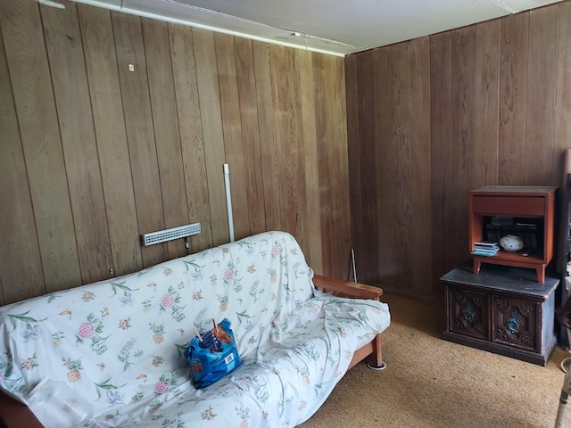 17-4136 Kukui Camp Rd, Mountain View, HI 96771 - living area with wooden walls, carpet flooring, and a wood stove