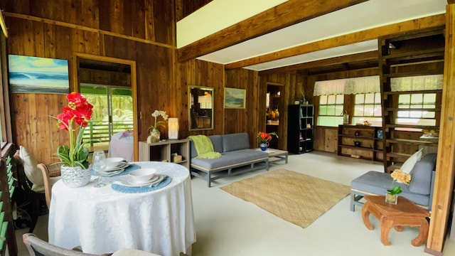 11-3170 Anuhea St, Volcano, HI 96785 - living area with wooden walls, finished concrete flooring, and beamed ceiling