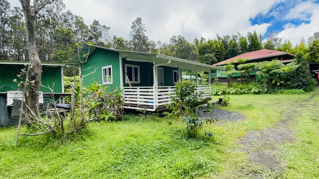 11-3170 Anuhea St, Volcano, HI 96785 - rear view of house featuring a deck and a yard