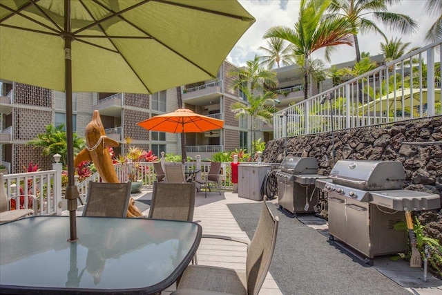 75-6016 Alii Dr Unit 323, Kailua-Kona, HI 96740 - view of patio with outdoor dining space and a grill