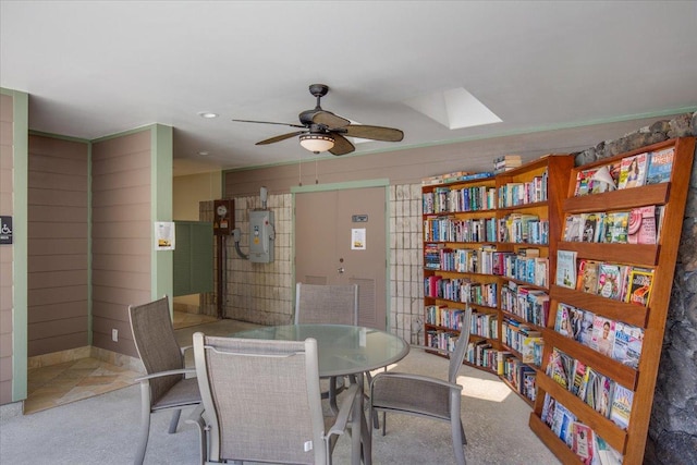 75-6016 Alii Dr Unit 323, Kailua-Kona, HI 96740 - dining space with a ceiling fan, carpet, and a skylight