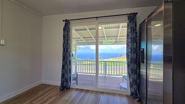 48-5241 Kukuihaele Rd, Honokaa, HI 96727 - unfurnished room featuring wood finished floors, a water view, and ornamental molding