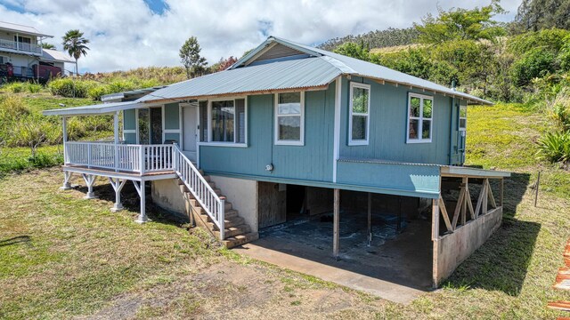48-5241 Kukuihaele Rd, Honokaa, HI 96727 - view of front of house featuring stairs, driveway, a metal roof, covered porch, and a front lawn