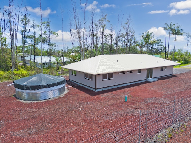 16-2148 Pukalani Dr, Pahoa, HI 96778 - view of side of property featuring view of scattered trees and a metal roof