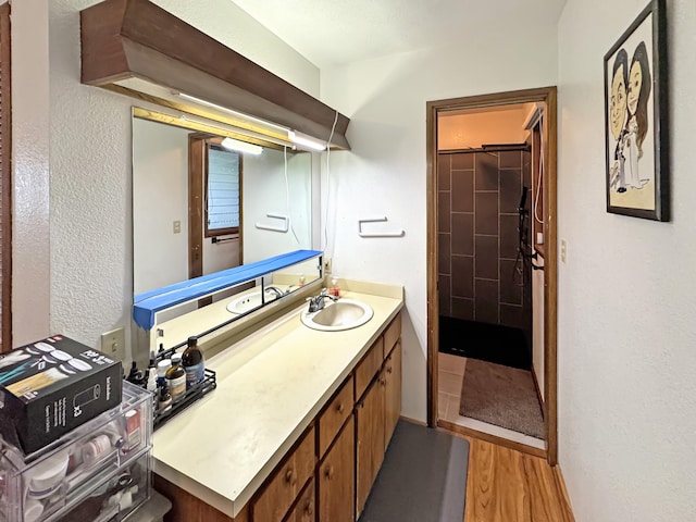 979-A Kumukoa St, Hilo, HI 96720 - full bath featuring vanity, a textured wall, wood finished floors, and a shower