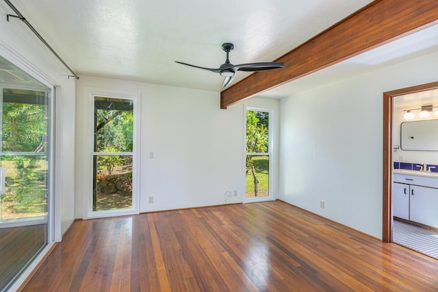 4417-B Kahili Makai St Unit D, Kilauea, HI 96754 - unfurnished room featuring wood finished floors, a ceiling fan, and beam ceiling