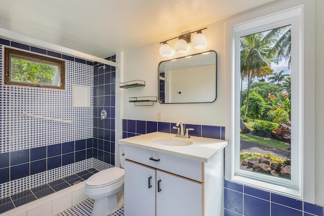 4417-B Kahili Makai St Unit D, Kilauea, HI 96754 - full bathroom with vanity, tiled shower, and tile walls