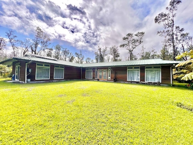 11-2920 S Apele Rd, Mountain View, HI 96771 - rear view of house featuring french doors, a yard, and a metal roof