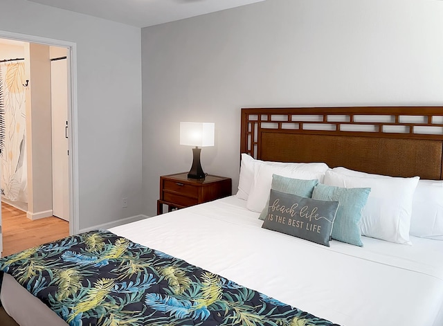 68-3831 Lua Kula St Unit H202, Waikoloa, HI 96738 - bedroom featuring wood finished floors and baseboards