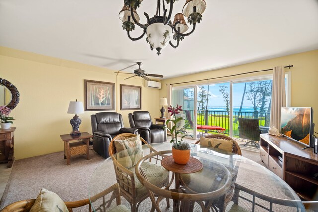4-1250 Kuhio Hwy Unit G204, Kapaa, HI 96746 - carpeted dining room featuring a wall mounted AC, a chandelier, and a ceiling fan